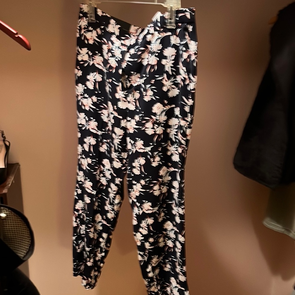 Navy blue flower print tapered pants.
